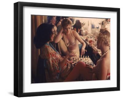 Showgirls Playing Chess Between Shows at Latin Quarter Nightclub - Black Framed Art Print Wall Art, 16x12