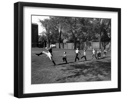 Uniformed Drum Major For University of Michigan Marching Band Practicing His High Kicking Prance - Black Framed Art Print Wall Art, 16x12